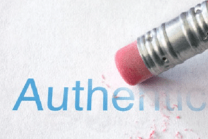 the word authenticity being erased by a pencil eraser