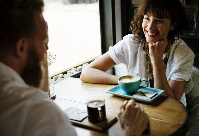 woman and man talking over coffee