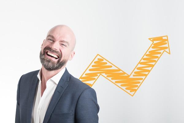 happy professional man with arrow focused upwards