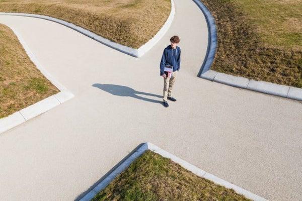 young man at center of 4 crossroads