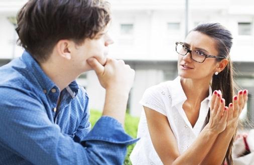 man and woman talking intently