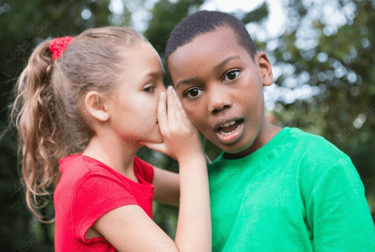 two little kids gossiping or telling secrets