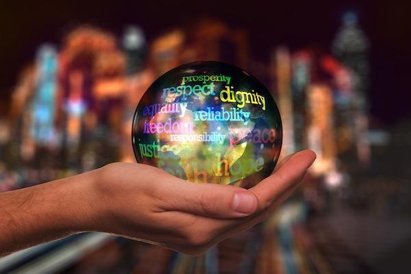 hand holding globe with values on it