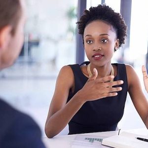 Women meeting with a man in a conference room