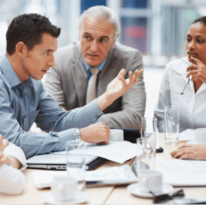 Business meeting all are intently listening to one man