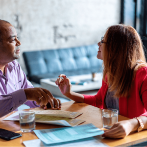 man and woman collaborating (talking about partnership)